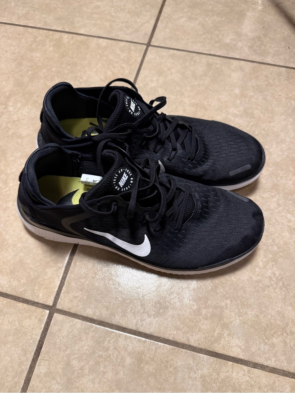 The Nike Free RN Black/White Lace-Up Low Top Sneakers in US size 11